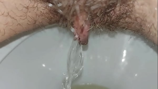 Hairy pussy pissing close up