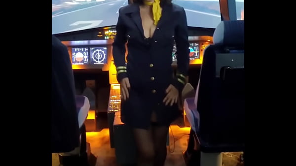 The flight attendant puts a dildo in her pussy on board